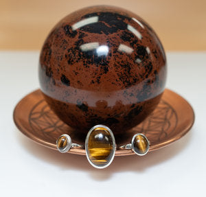 Copper bowl, Mahogany Obsidian Sphere, Tiger's Eye Rings